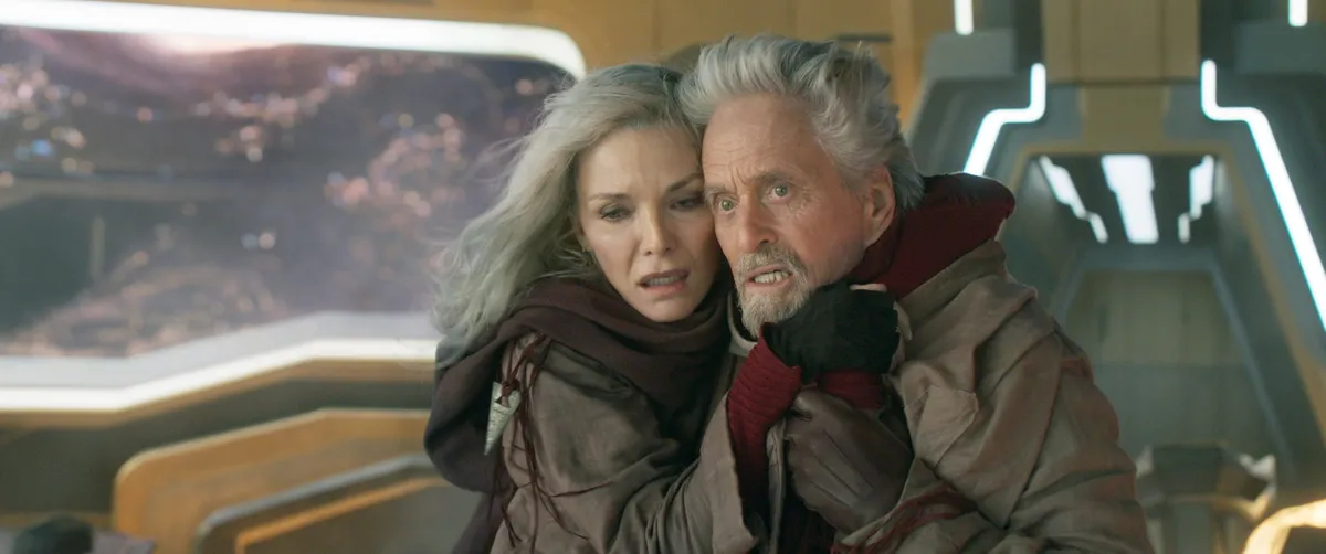 Michael Douglas as Hank Pym in his Ant-Man costume looking thoughtful.