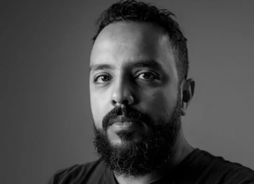 Mohamed Kordofani, a Sudanese filmmaker, looking thoughtful and engaged.