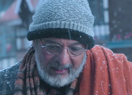 A close-up portrait of veteran actor Nana Patekar smiling thoughtfully.