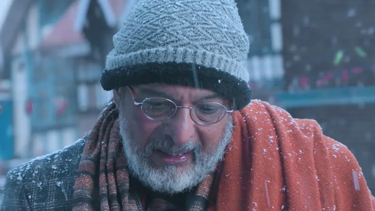 A close-up portrait of veteran actor Nana Patekar smiling thoughtfully.