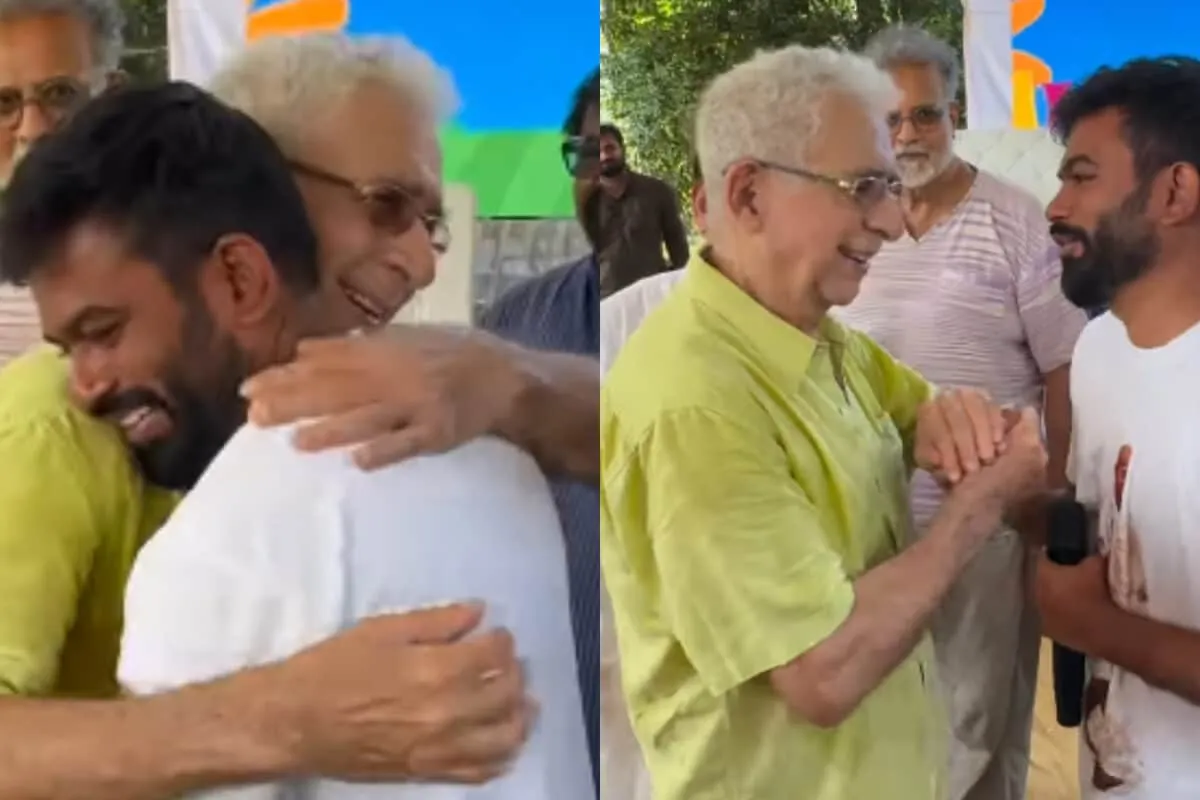 Naseeruddin Shah and Abhijeet Dipke shaking hands at a meeting.