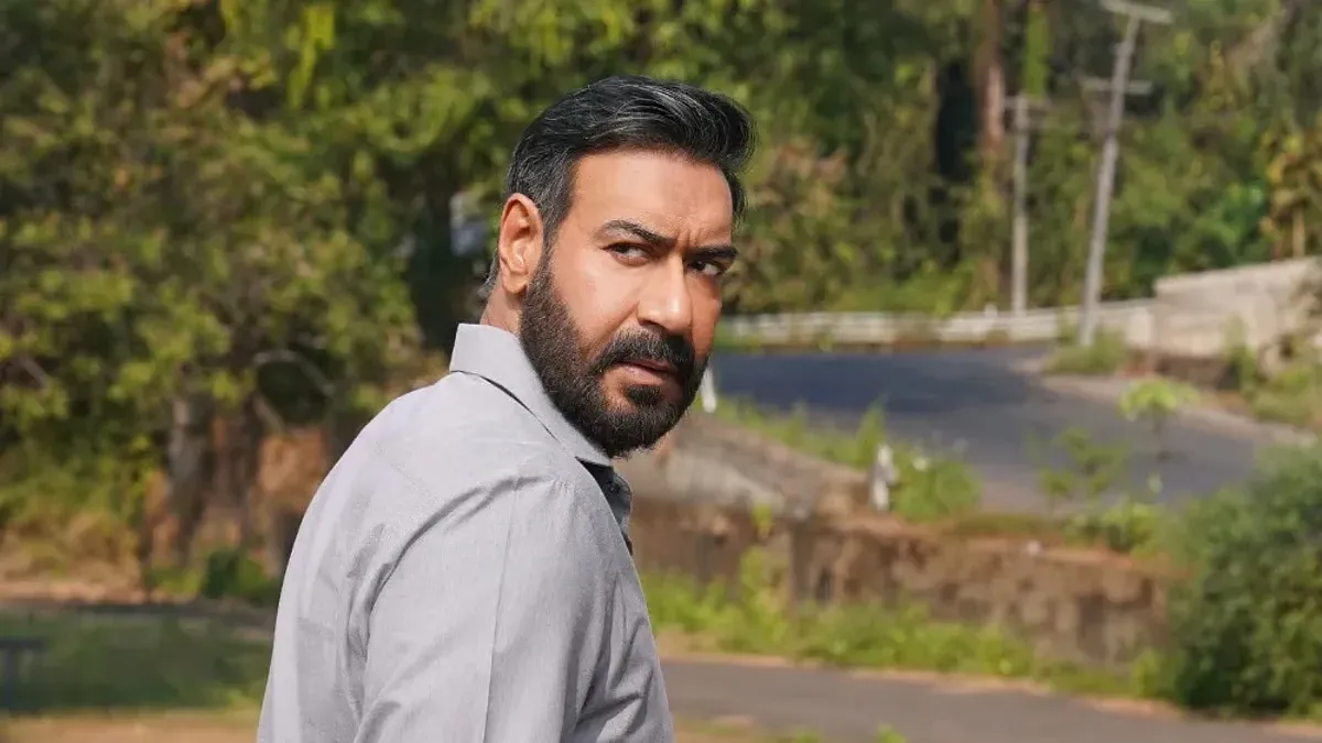 Ajay Devgn smiling in a still from Drishyam 3.