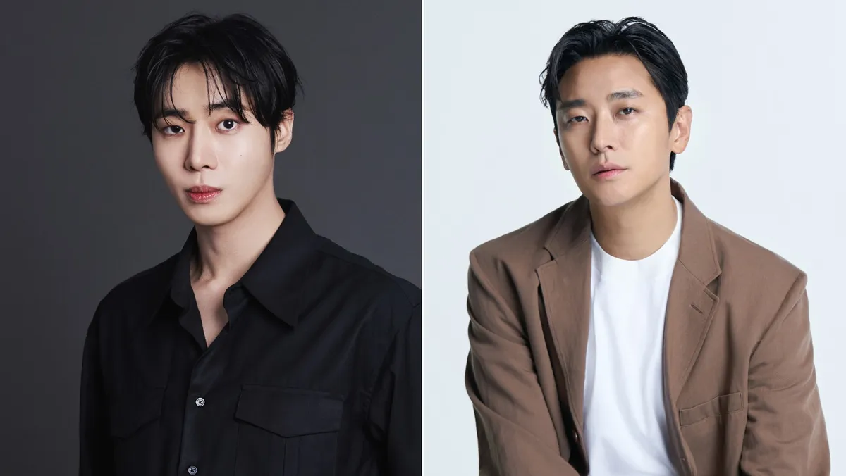 Ju Ji-hoon and Choo Young-woo in scrubs looking serious.