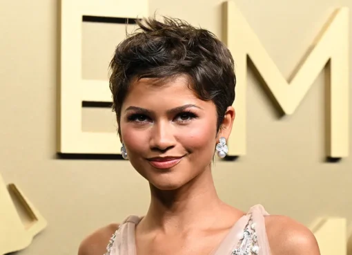Zendaya posing confidently, possibly in a sleek, modern outfit.
