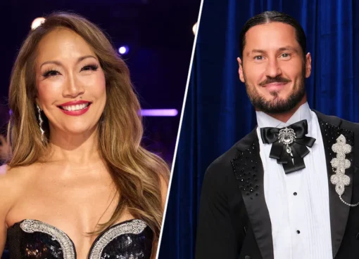 Carrie Ann Inaba and Val Chmerkovskiy hugging on the Dancing with the Stars set.