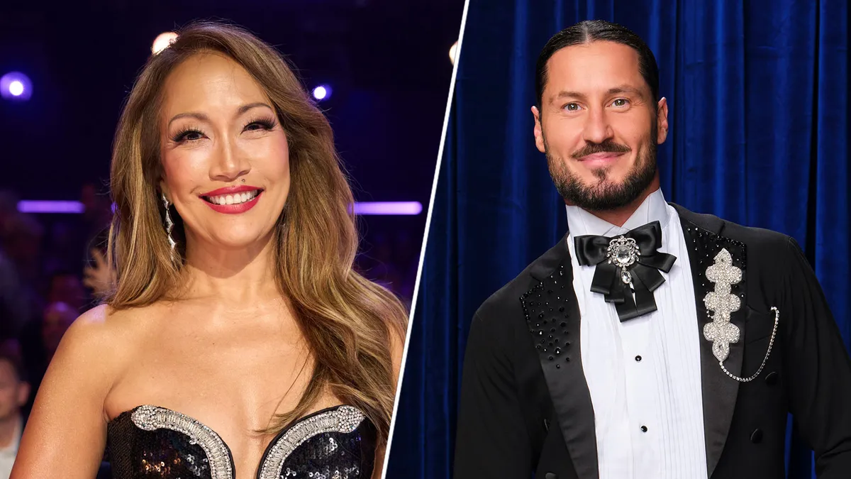 Carrie Ann Inaba and Val Chmerkovskiy hugging on the Dancing with the Stars set.