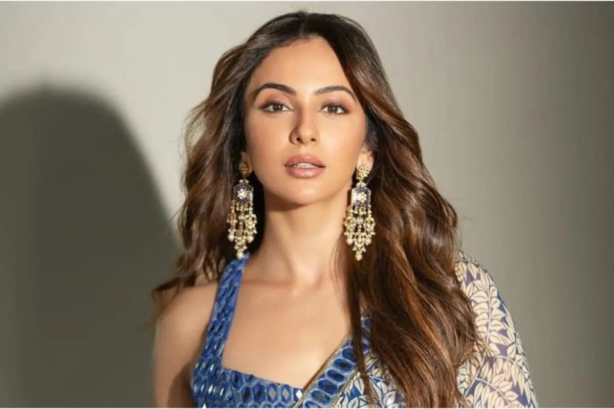 Rakul Preet Singh smiling and looking confident.