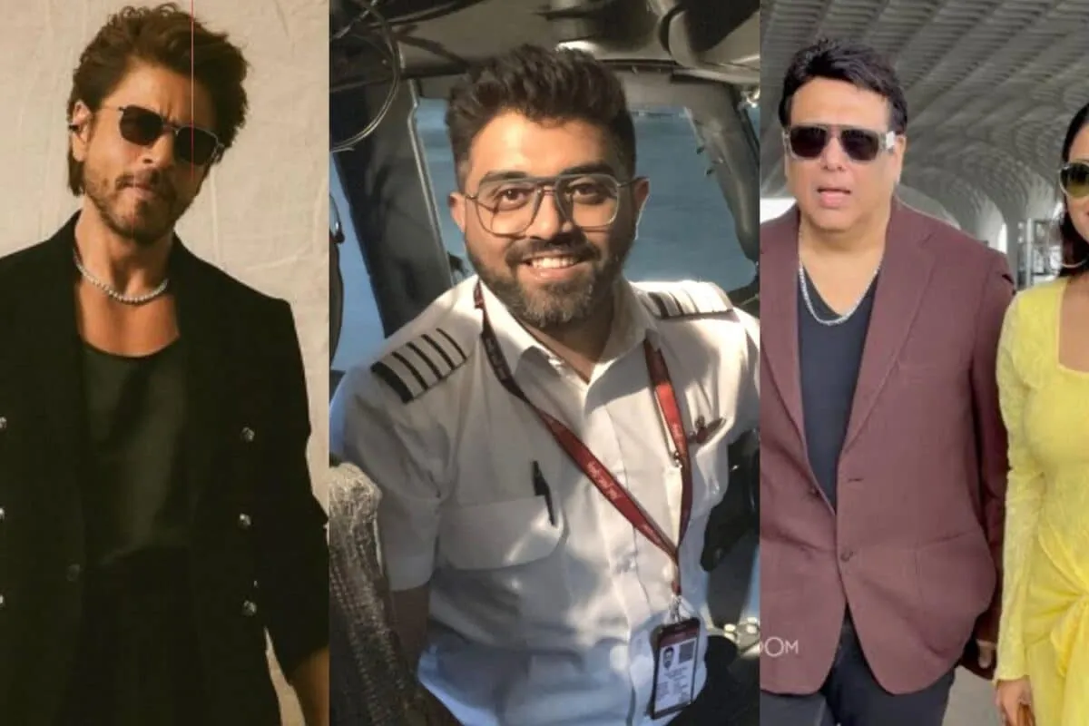 Shah Rukh Khan smiling with a pilot.
