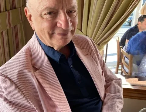 Portrait of Ken Atchity smiling.