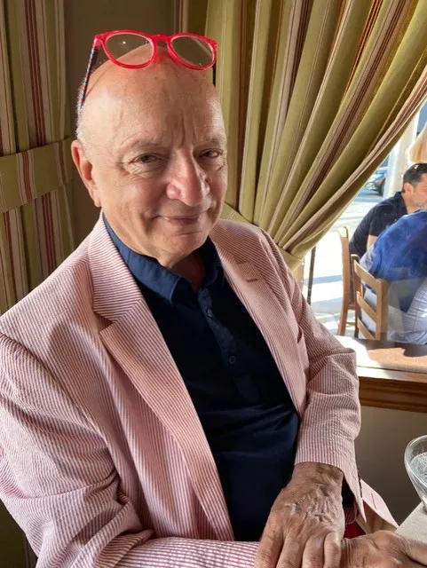Portrait of Ken Atchity smiling.