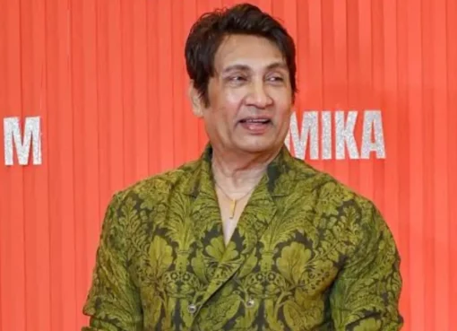 Actor Shekhar Suman speaking on a microphone