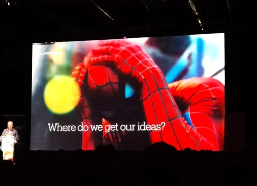 Spider-Man swinging through a vibrant city with visual effects highlighting his movement and a dynamic, colorful aesthetic.