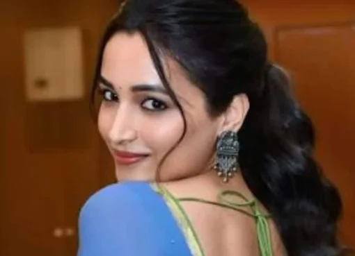 Srinidhi Shetty smiling, looking elegant and confident.
