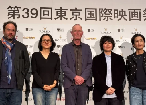 Filmmaker Rolf de Heer speaking at a press conference at the Tokyo International Film Festival.