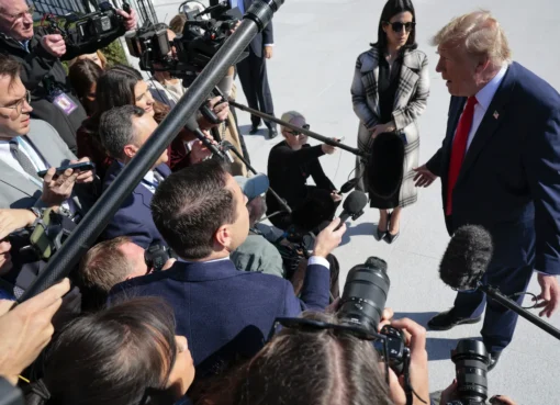 President Donald Trump speaking at a podium.