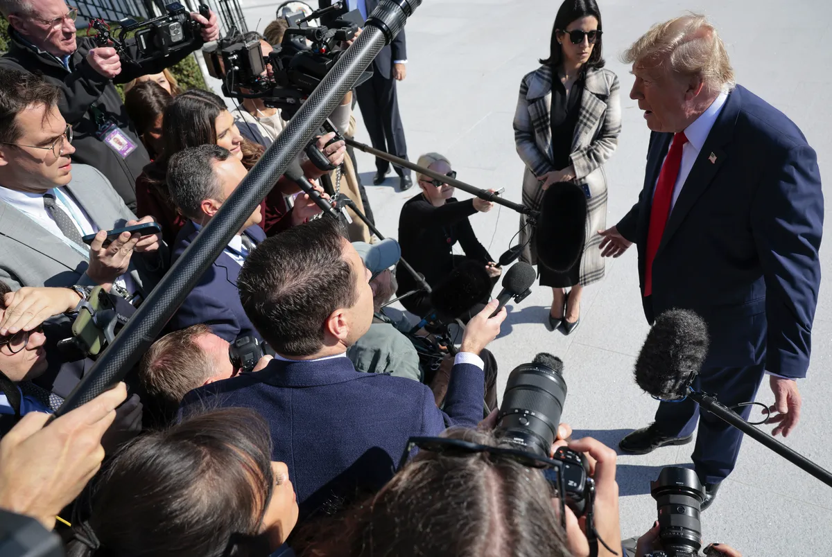 President Donald Trump speaking at a podium.