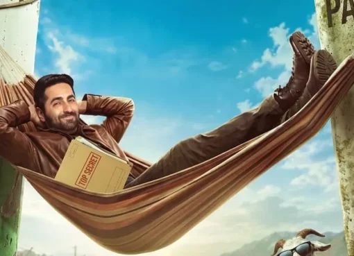 Ayushmann Khurrana and Sara Ali Khan looking like spy characters in a brightly lit, action-packed movie scene.
