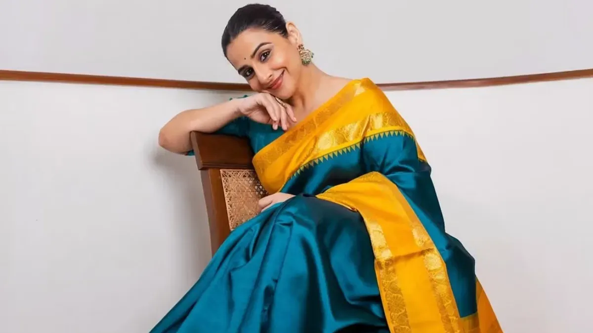 Vidya Balan smiling elegantly at an event.