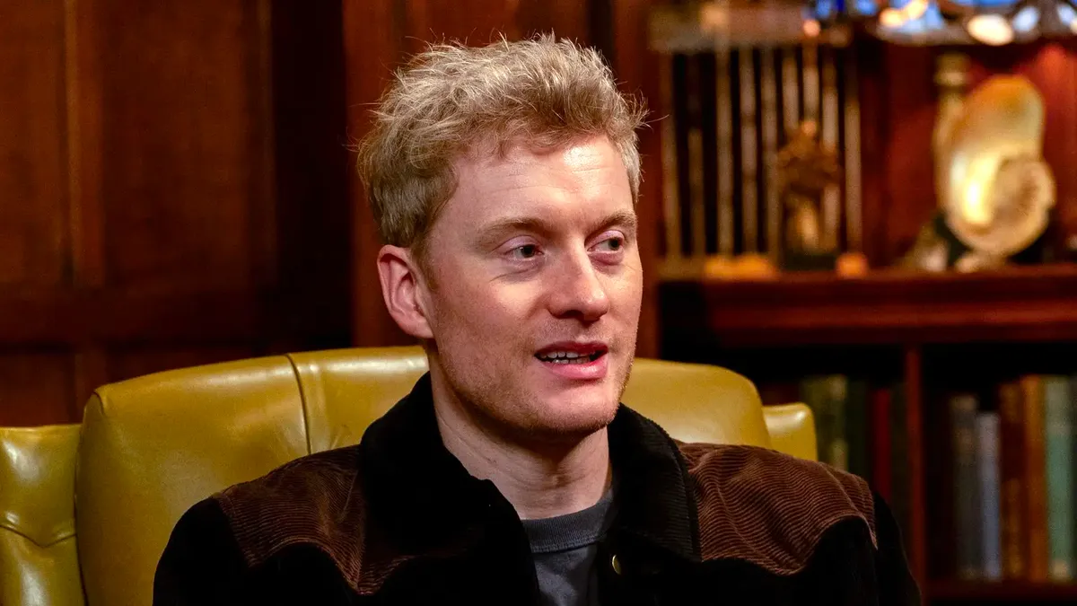 Comedian James Acaster looking thoughtful or surprised.