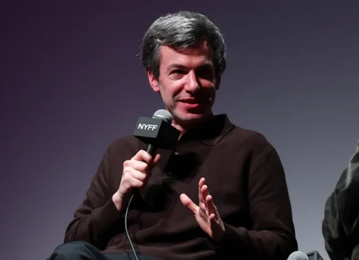 Nathan Fielder looking thoughtful, discussing his experience living with Elizabeth Holmes for his new documentary.