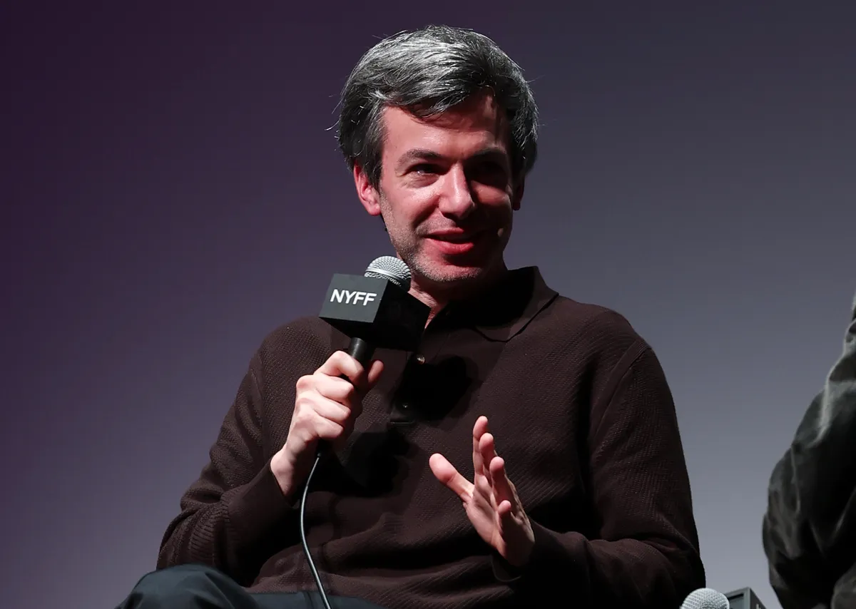 Nathan Fielder looking thoughtful, discussing his experience living with Elizabeth Holmes for his new documentary.