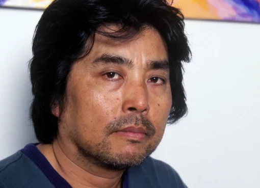 A portrait photo of Japanese author and filmmaker Ryu Murakami.