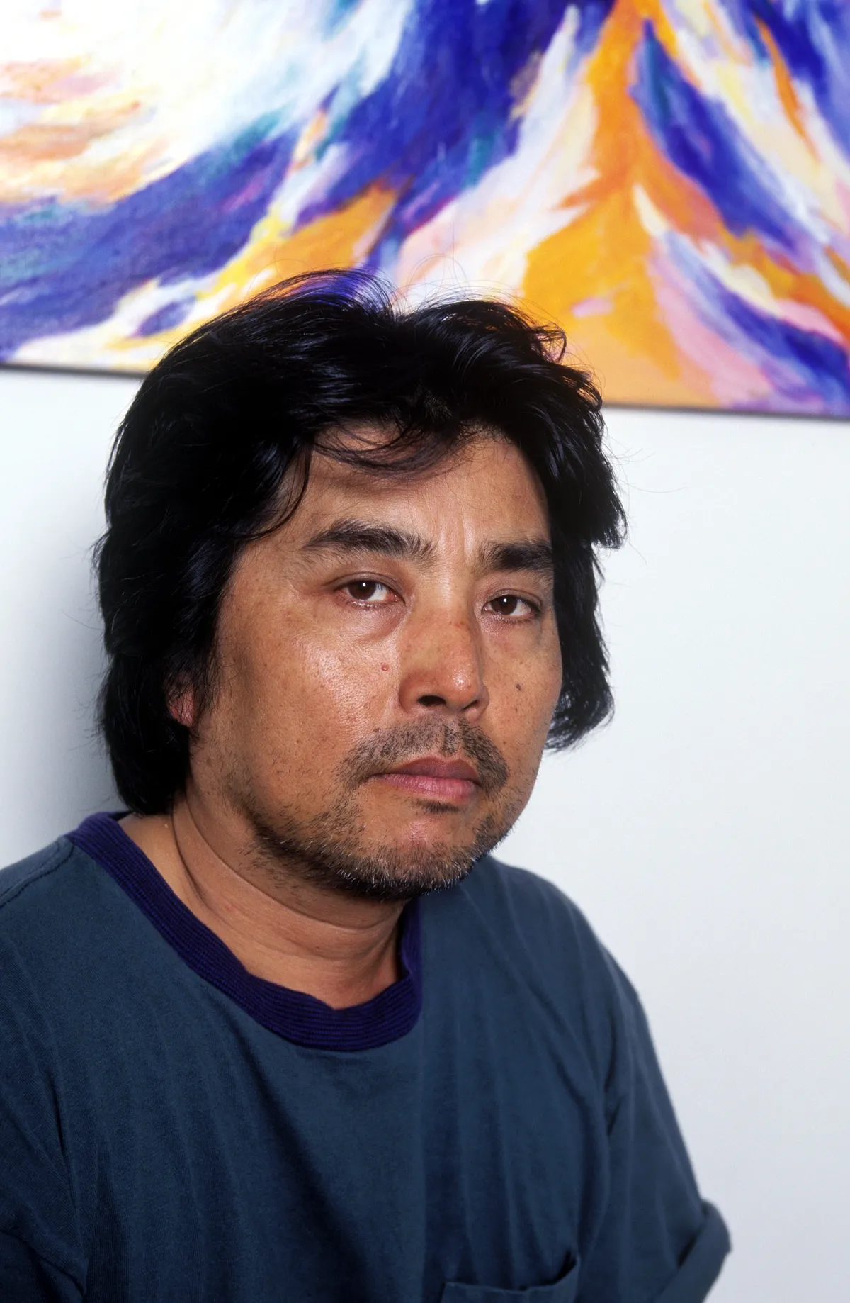 A portrait photo of Japanese author and filmmaker Ryu Murakami.