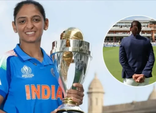 Harmanpreet Kaur in her blue Indian cricket jersey looking thoughtful.