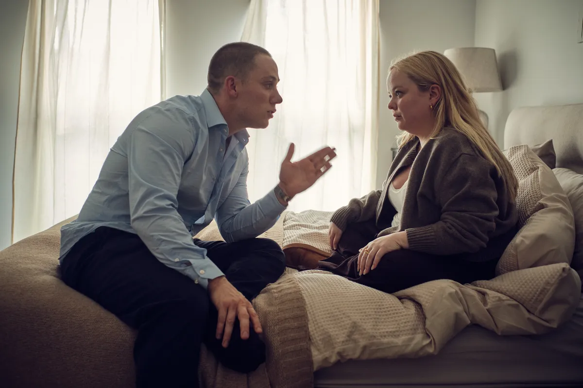 Nicola Coughlan looking intense in a scene from 'I Am Helen' trailer.