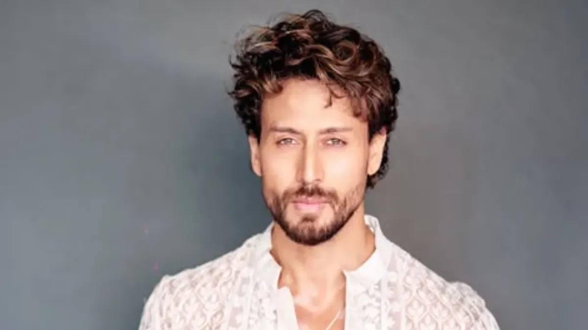 Tiger Shroff playing football.