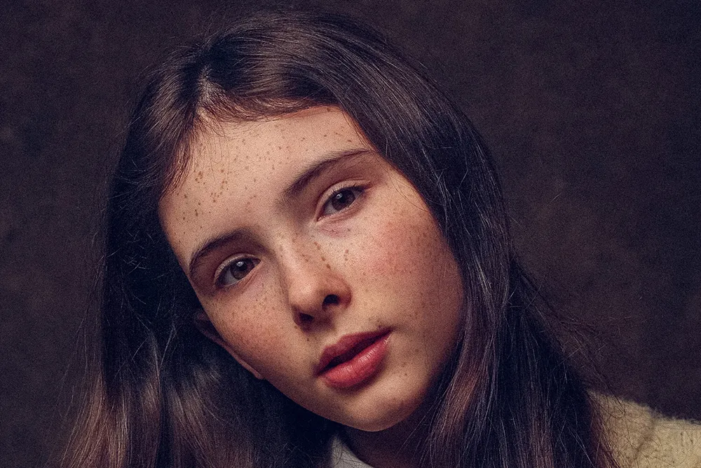 Portrait of young Irish-English actress Bodhi Rae Breathnach looking thoughtful and artistic.