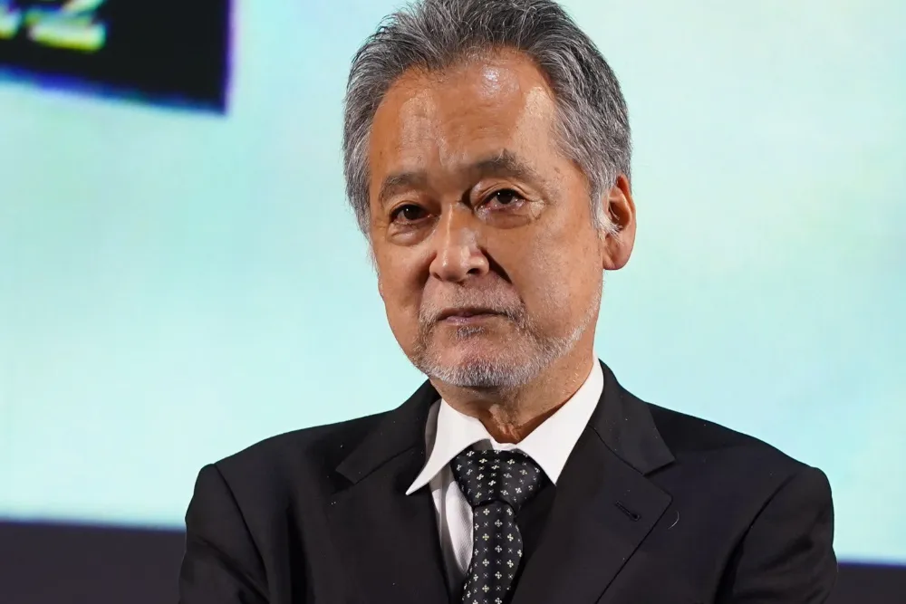 Close-up photo of Japanese film director Zeze Takahisa speaking at a masterclass.